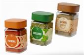 Spice jar labels on square glass containers of paprika, oregano, and cumin with colourful illustrated designs.