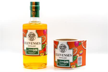 Gin labels for Elevenses Distillery Orange & Passionfruit Gin with a bright orange design featuring fruit illustrations and bold green accents.