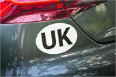 UK Vehicle sticker with bold black lettering on a white oval background, designed for clear identification when driving
