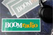 Vehicle stickers for Boom Radio with a green background and bold white and yellow text, printed on durable vinyl for outdoor use.