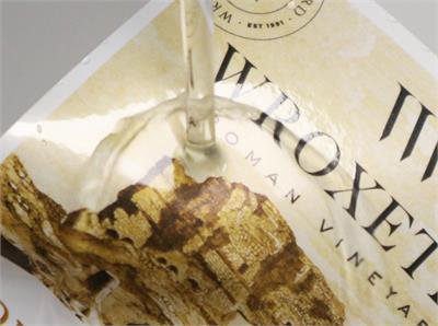 Waterproof stickers with water being poured onto them